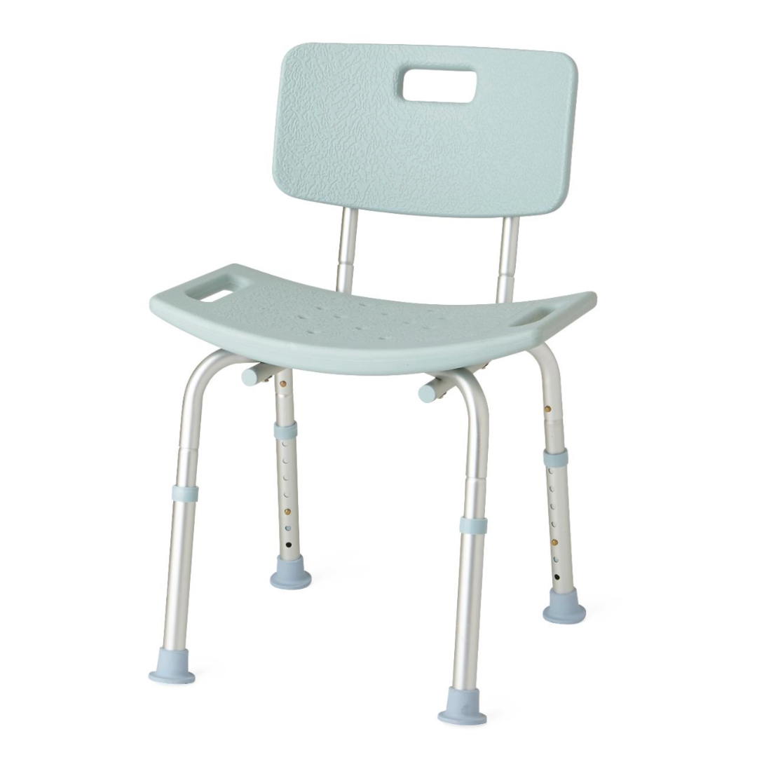 The Medline Shower Chair with Backrest & Suction Grip Feet is a light blue bath bench featuring a textured backrest, antimicrobial protection, and seat drainage holes. It has adjustable aluminum legs with slip-resistant rubber feet and a handle cutout in the backrest for easy handling.